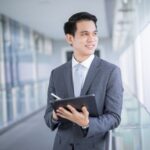 young asian business man holding